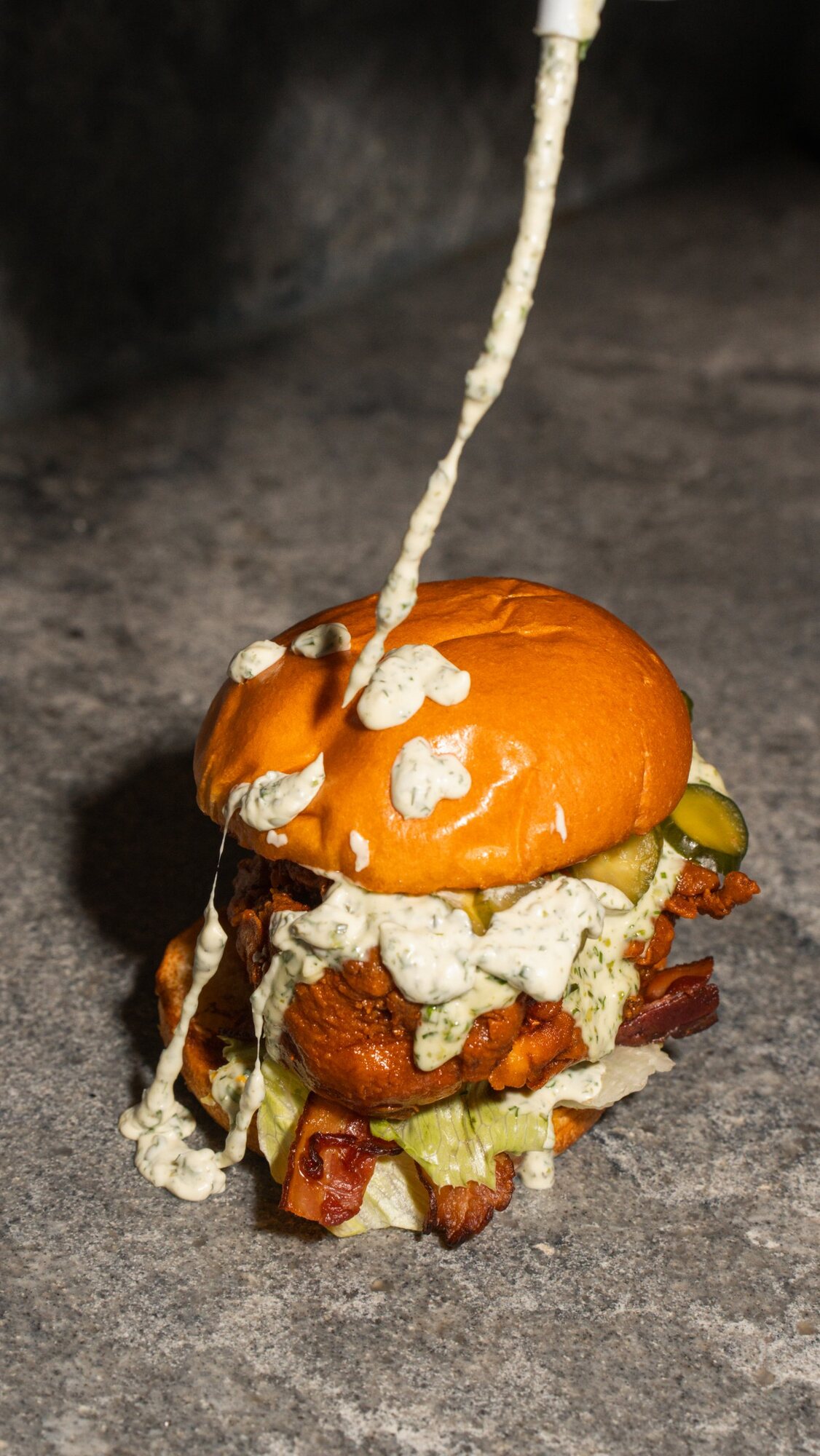 Herb ranch poured over a crispy chicken sandwich