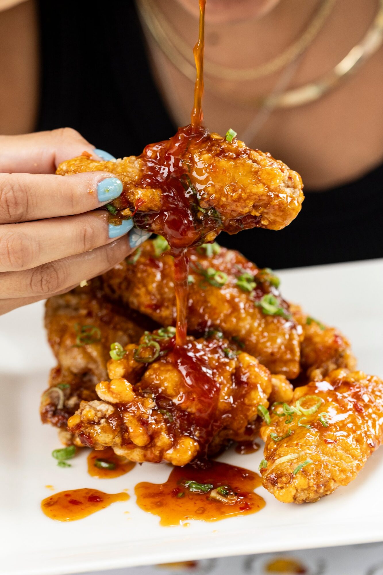 Sticky glazed wings with sauce dripping