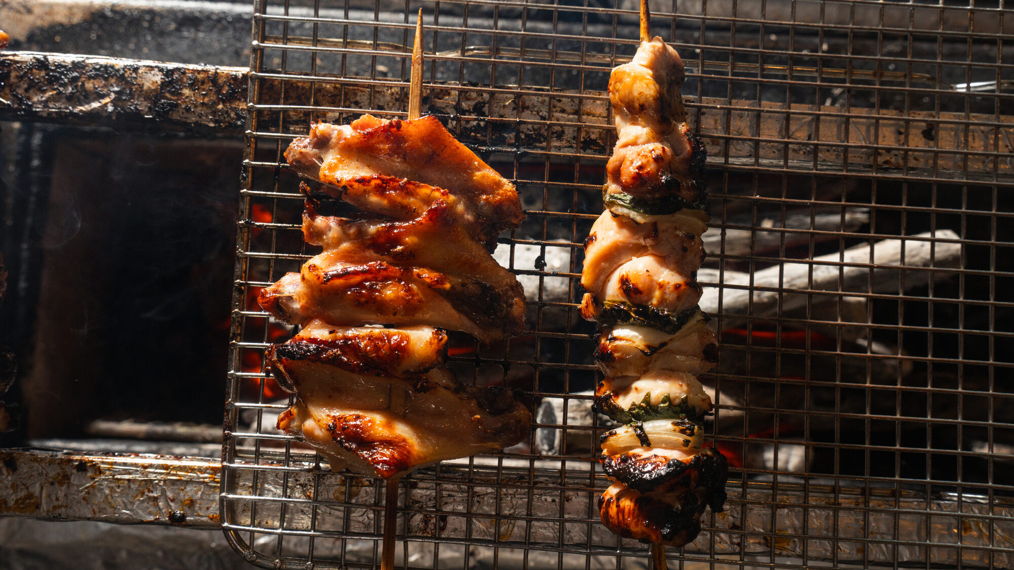 Chicken skewers over binchotan on the robata grill