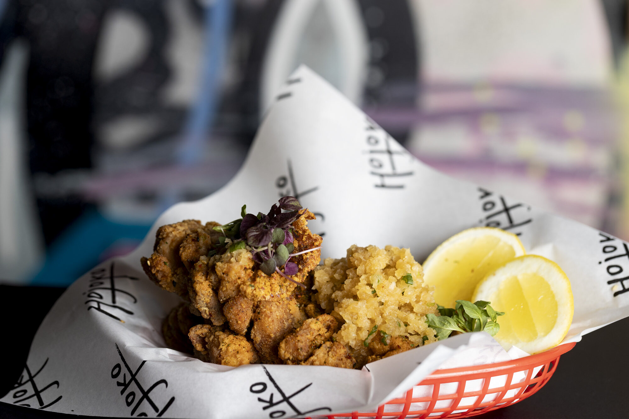 Karaage in a red basket lined with Hojoko paper
