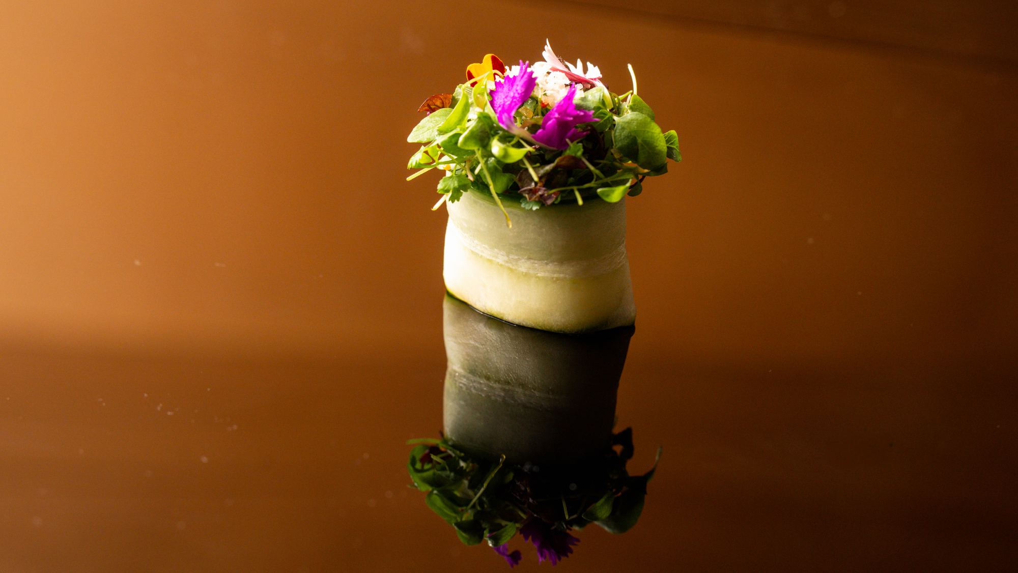 Cucumber roll crowned with flowers